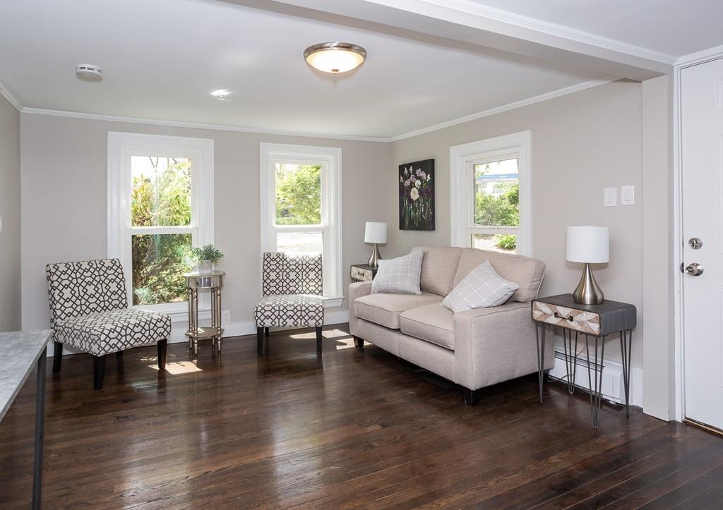 34 Plumtree Road Springfield, MA 01118 - Photo 5 of 22 a living room with furniture and a wooden floor
