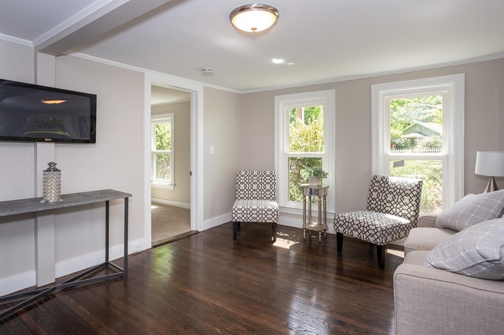 34 Plumtree Road Springfield, MA 01118 - Photo 6 of 22 a living room with furniture and a flat screen tv