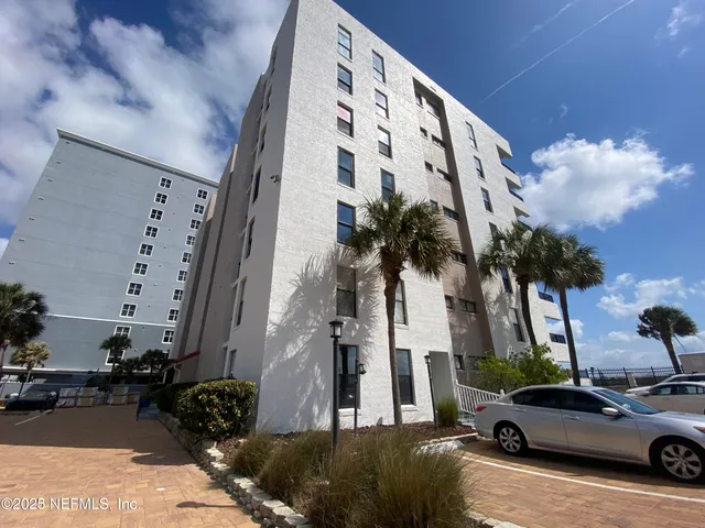 a view of a street with cars