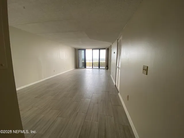 wooden floor in a hall with an entryway