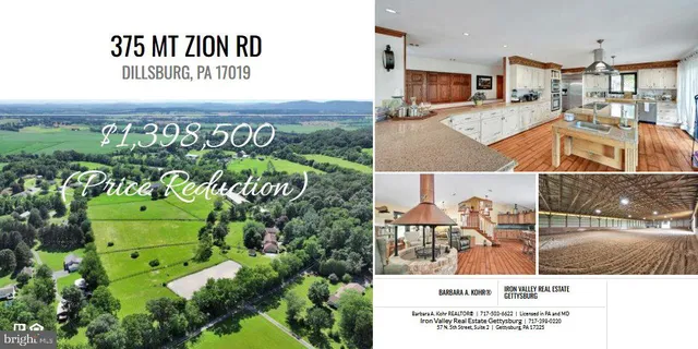 a living room with furniture a rug and a chandelier