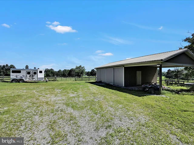 a view of a balcony with wooden floor and door