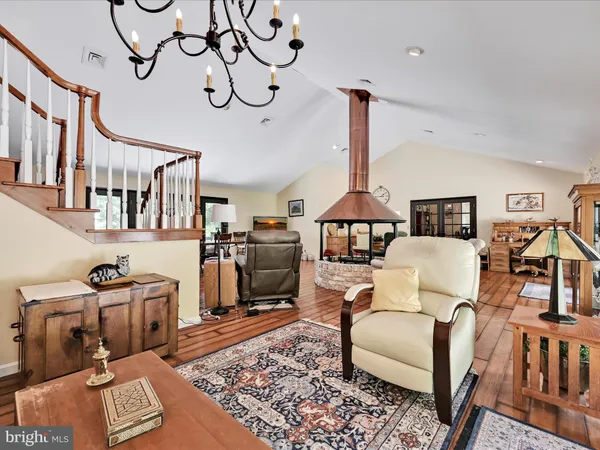 a large white kitchen with a large window and counter space