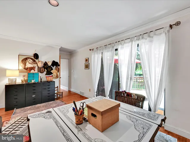 a living room with furniture or couch and a floor to ceiling window
