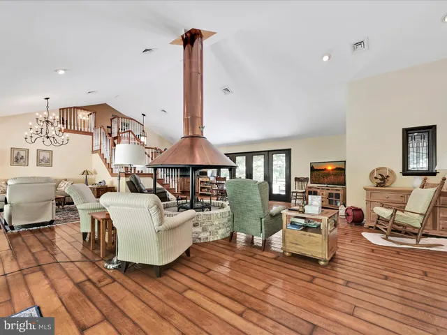 a large white kitchen with a large window