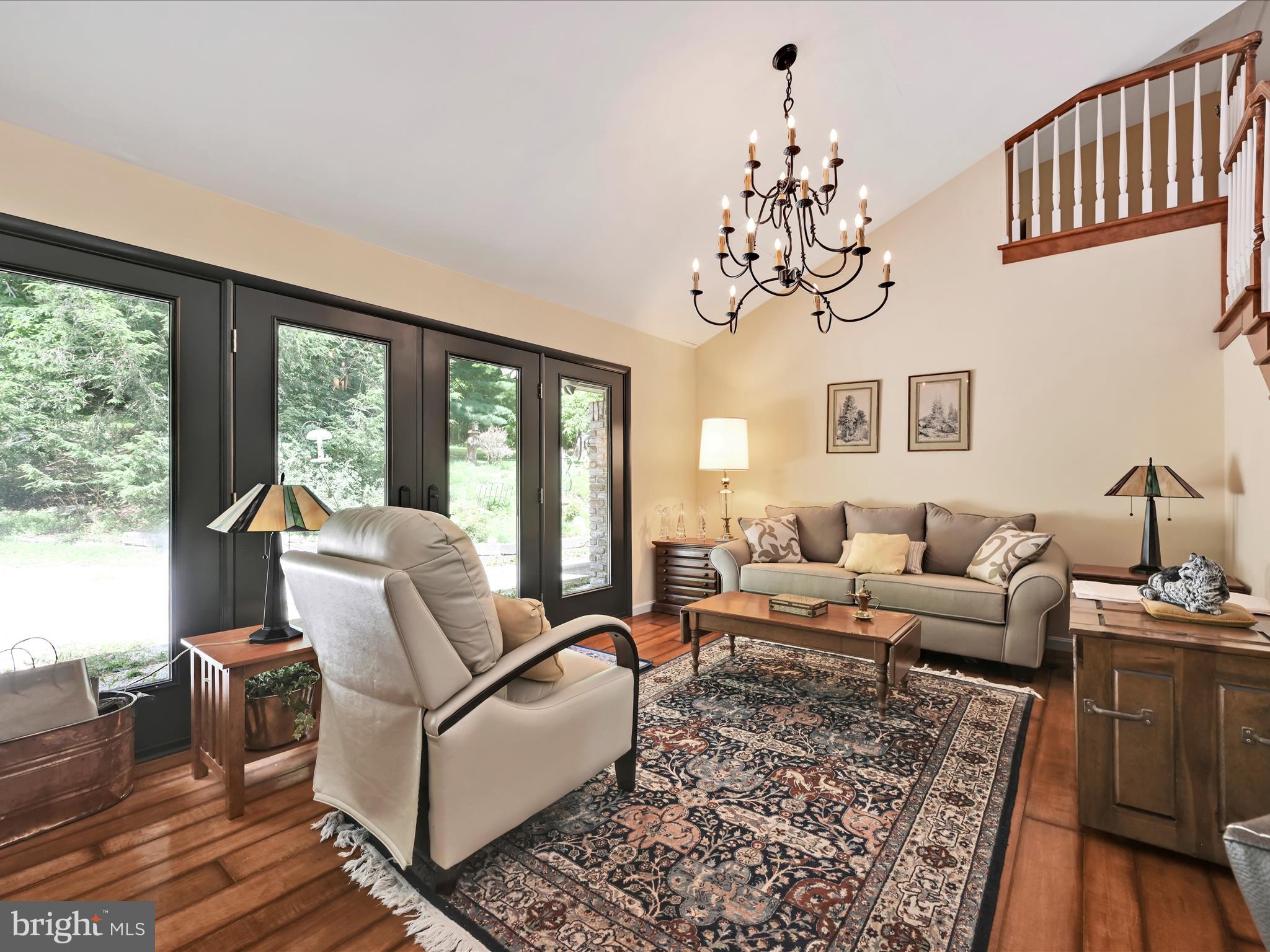 375 Mt Zion Road Dillsburg, PA 17019 - Photo 47 of 57 a living room with furniture or couch and a floor to ceiling window