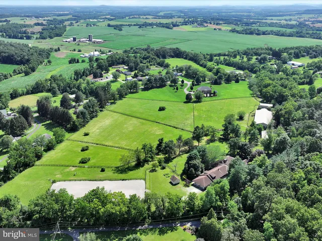 an aerial view of a houses with outdoor space and street view