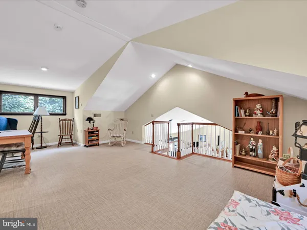 a view of a livingroom with furniture window and wooden floor