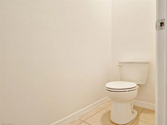 a bathroom with a toilet and a sink