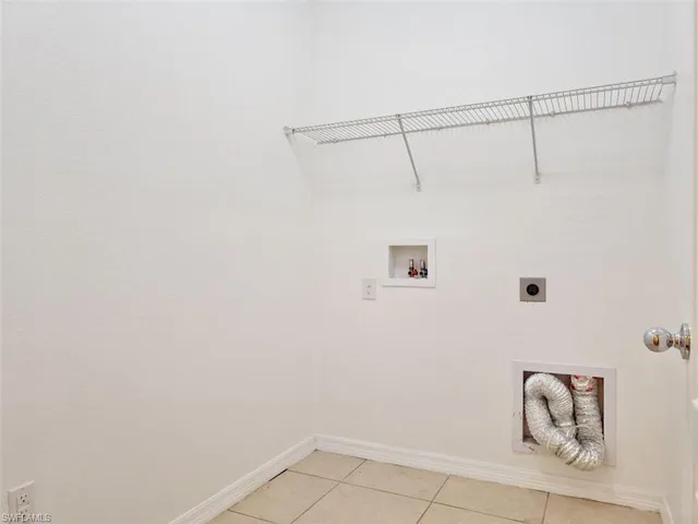 a view of an empty room and a window