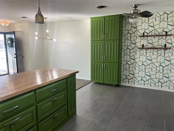 a kitchen with a sink and refrigerator