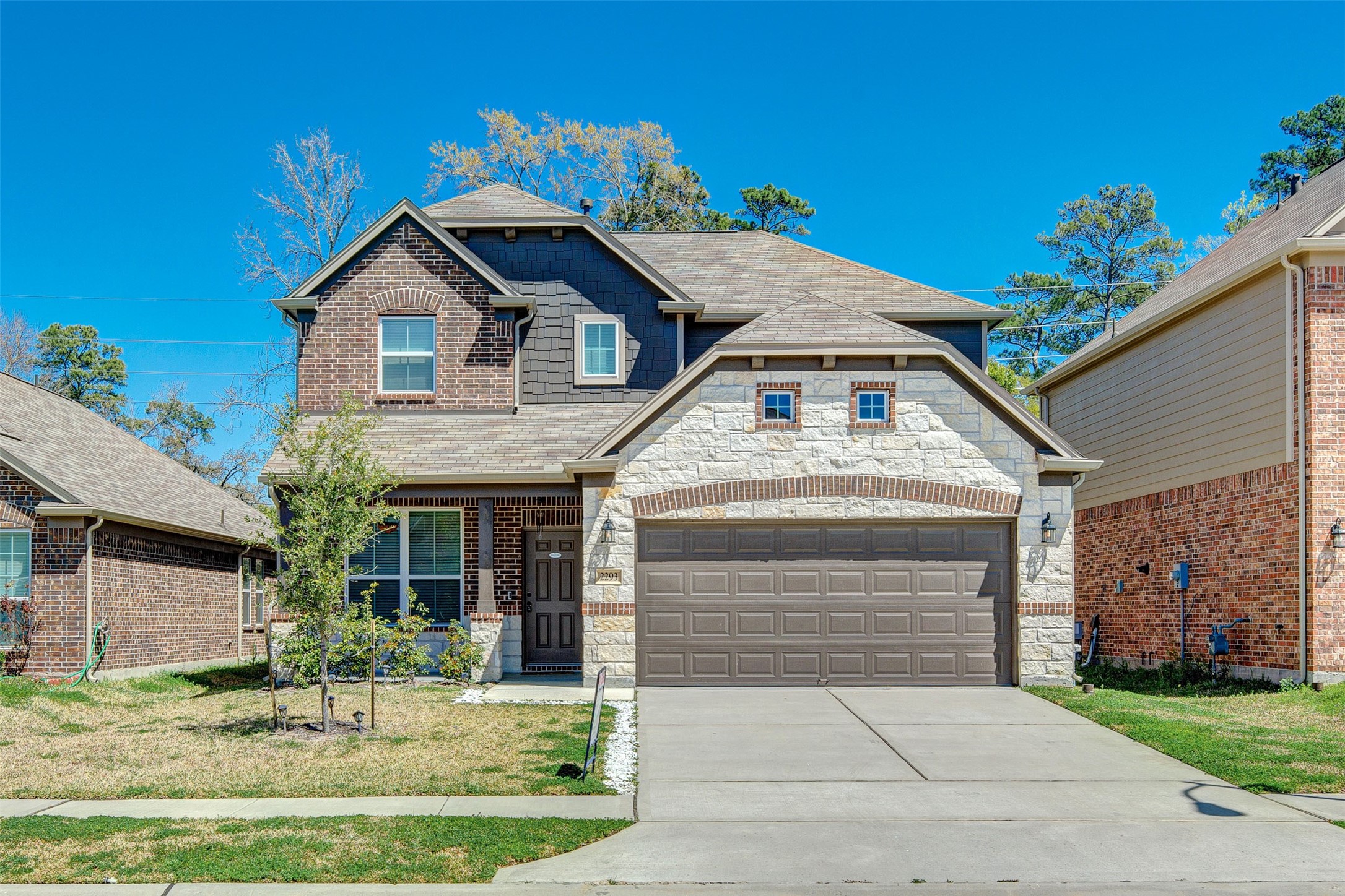 2293 Garden Square Path Spring, TX 77386 - Photo 2 of 32 a front view of a house with a yard