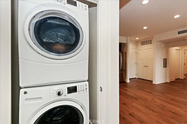 a view of a hallway with washer and dryer