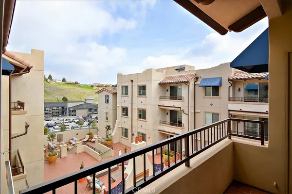a view of a balcony with city view