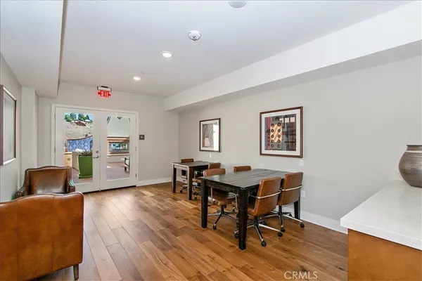 a workspace with furniture and wooden floor