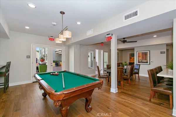 a room with furniture and pool table
