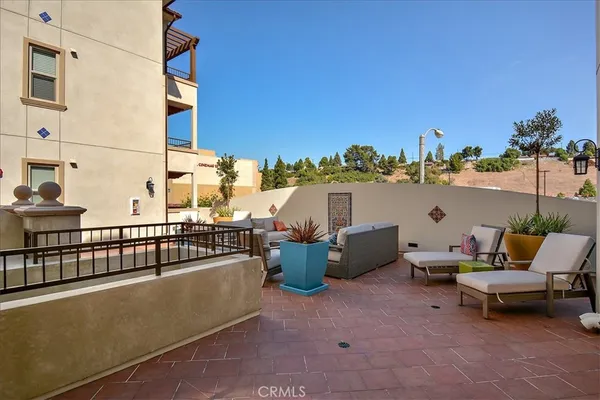 a view of a terrace with furniture