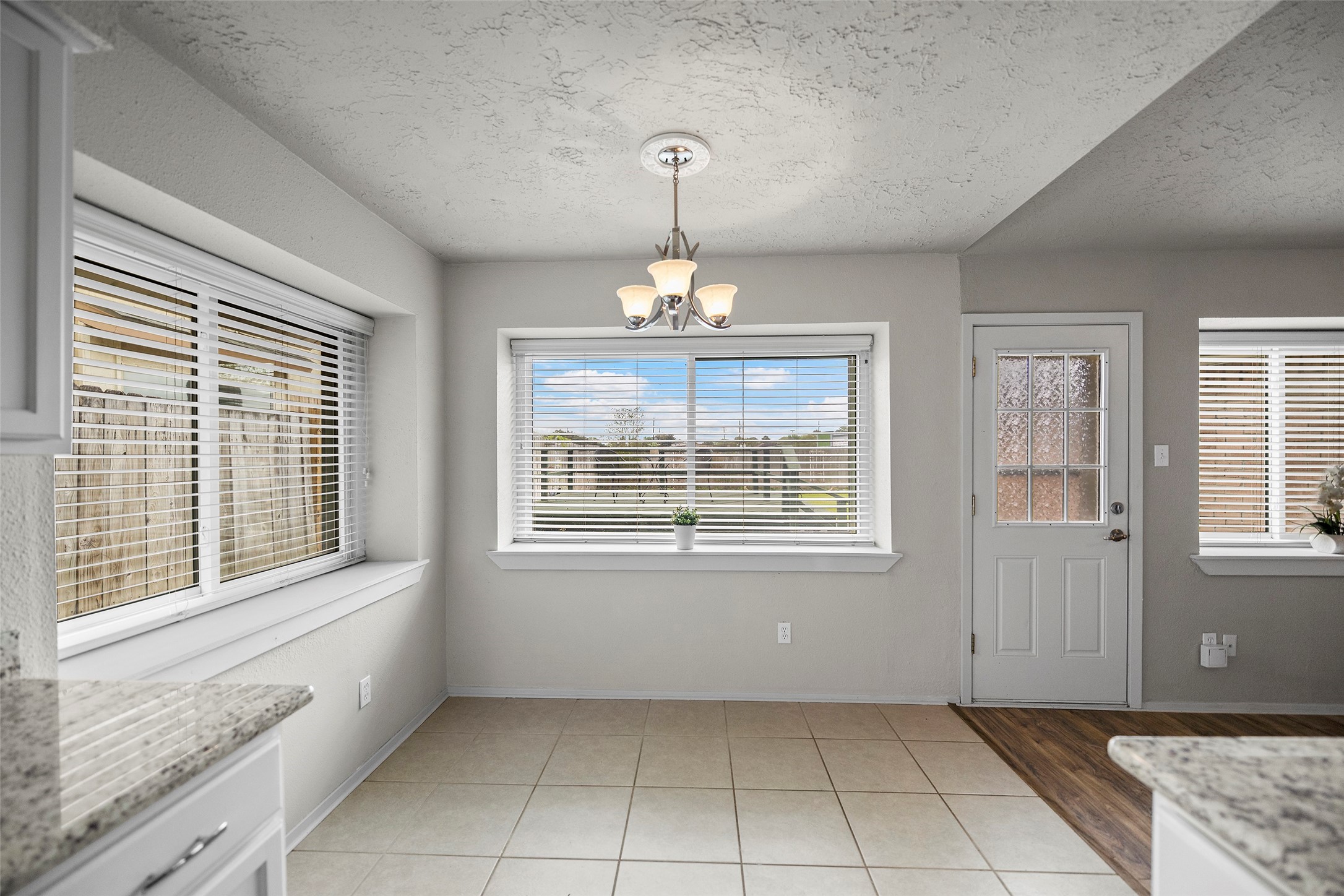 3419 Acorn Springs Lane Spring, TX 77389 - Photo 11 of 24 an empty room that has a window and chandelier