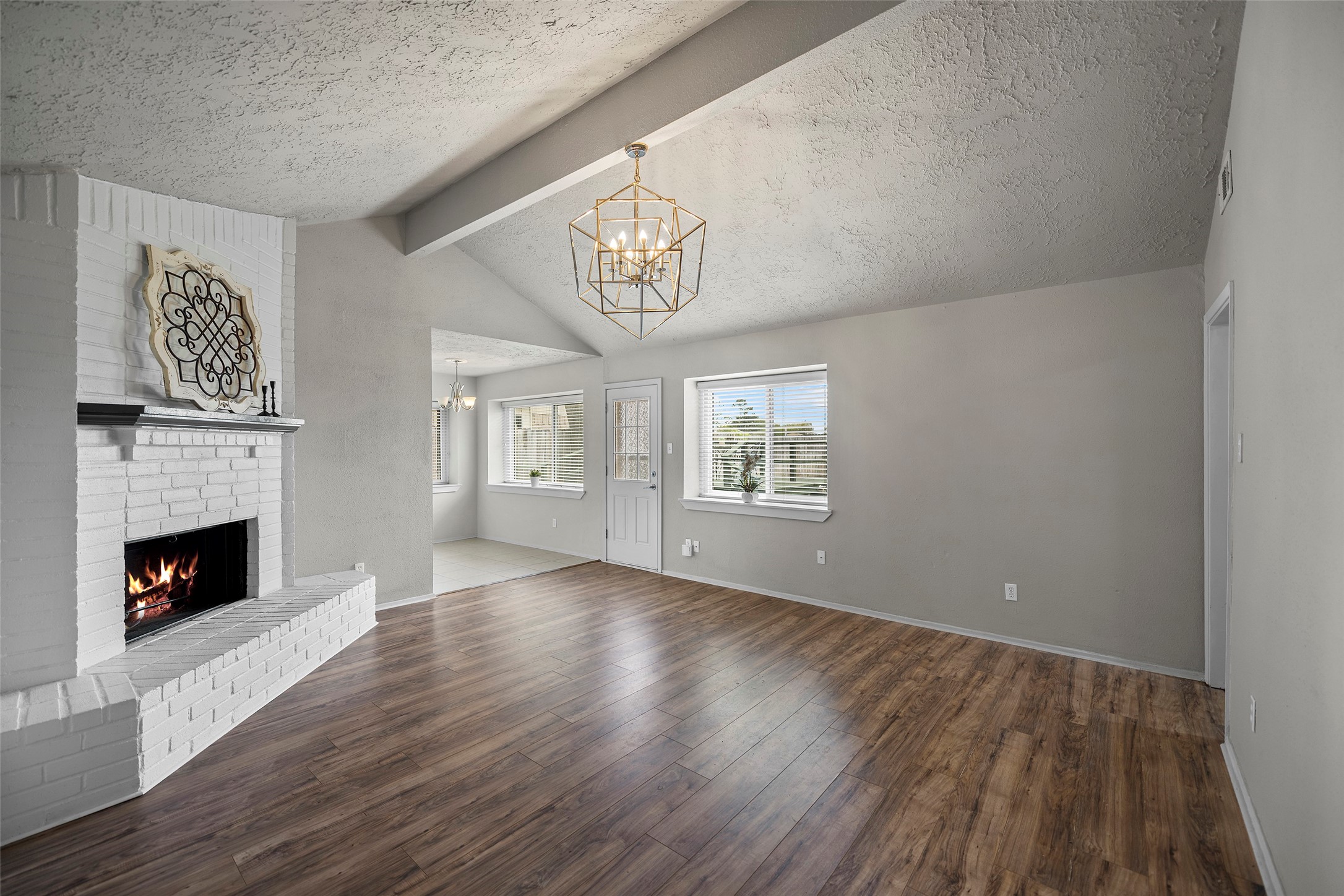 3419 Acorn Springs Lane Spring, TX 77389 - Photo 2 of 24 a view of an empty room with wooden floor and a window