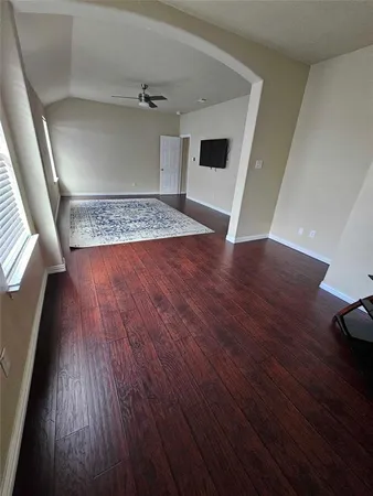 a view of a livingroom with wooden floor