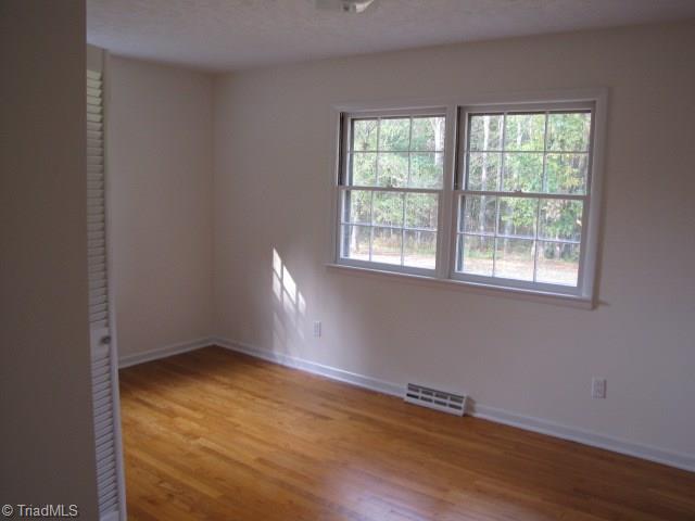 4596 Shady Grove Road Providence, NC 27315 - Photo 12 of 23 Bedroom 2 - new paint and refinished hardwoods.