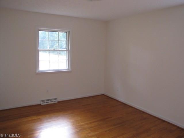 4596 Shady Grove Road Providence, NC 27315 - Photo 14 of 23 Master Bedroom - new paint and refinished hardwoods.
