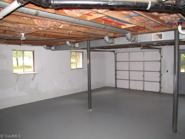 4596 Shady Grove Road Providence, NC 27315 - Photo 20 of 23 Basement Garage Area
