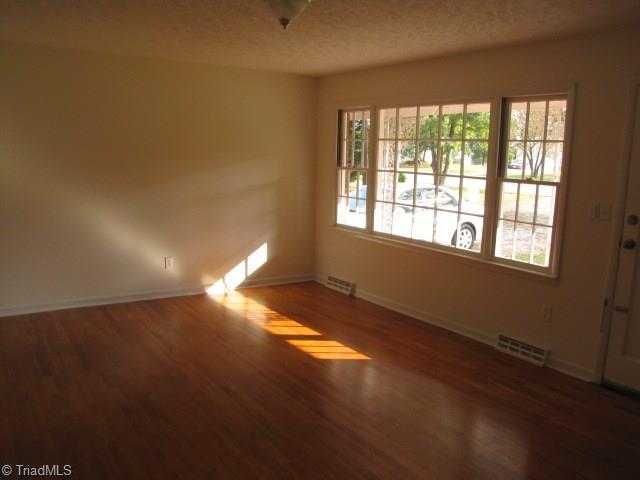4596 Shady Grove Road Providence, NC 27315 - Photo 6 of 23 Living Room - Newly painted and refinished hardwood floors. Lots of natural light.