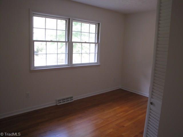 4596 Shady Grove Road Providence, NC 27315 - Photo 10 of 23 Bedroom 1 - new paint and refinished hardwoods.
