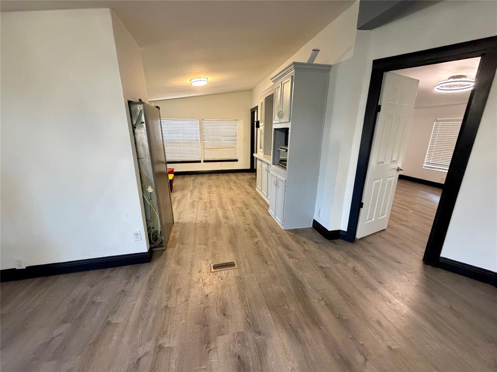 222 Hix Road Cleburne, TX 76031 - Photo 8 of 27 a view of a hallway with wooden floor