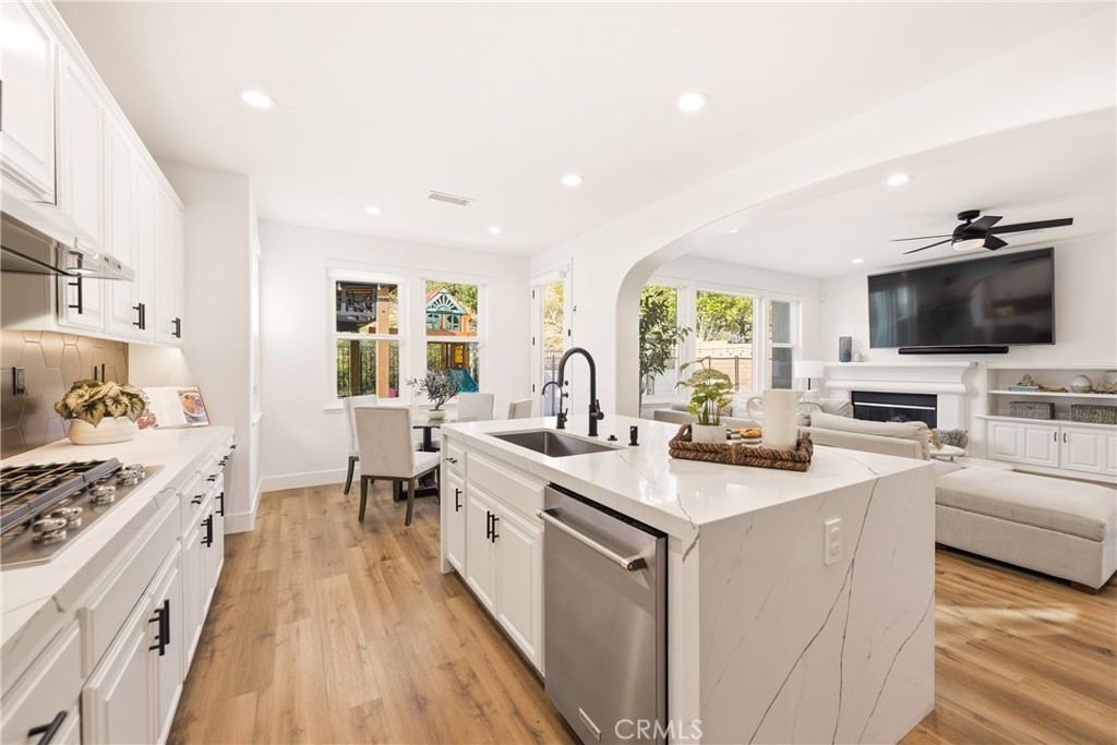 14431 Shawnee Street Moorpark, CA 93021 - Photo 13 of 72 a view of living room with granite countertop furniture and a flat screen tv