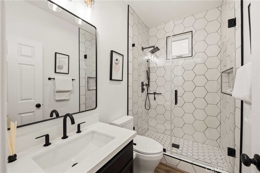 14431 Shawnee Street Moorpark, CA 93021 - Photo 32 of 72 a bathroom with a sink toilet and shower