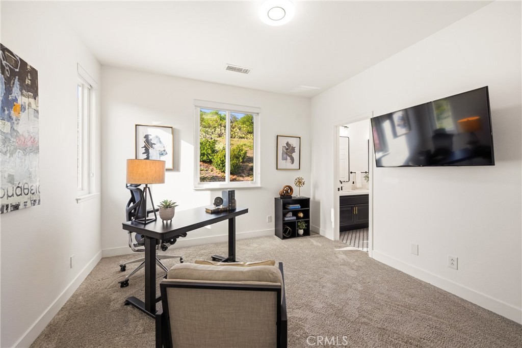 14431 Shawnee Street Moorpark, CA 93021 - Photo 39 of 72 a view of a livingroom with furniture and a flat screen tv