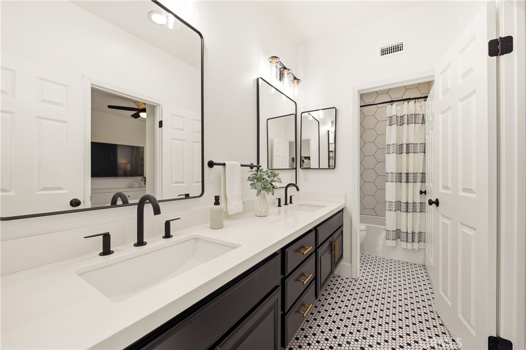 14431 Shawnee Street Moorpark, CA 93021 - Photo 40 of 72 a bathroom with a double vanity sink mirror and