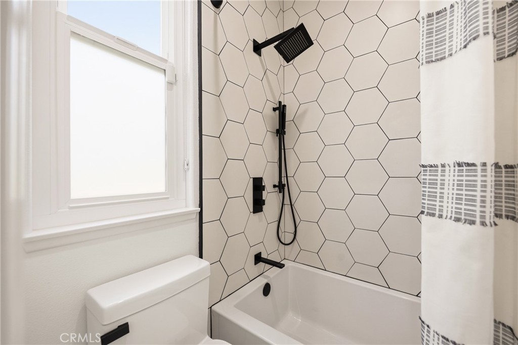 14431 Shawnee Street Moorpark, CA 93021 - Photo 41 of 72 a bathroom with a bathtub and shower