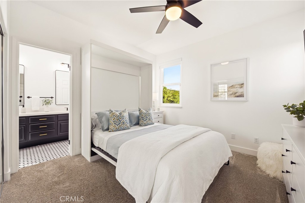 14431 Shawnee Street Moorpark, CA 93021 - Photo 43 of 72 a bedroom with a bed and a chandelier