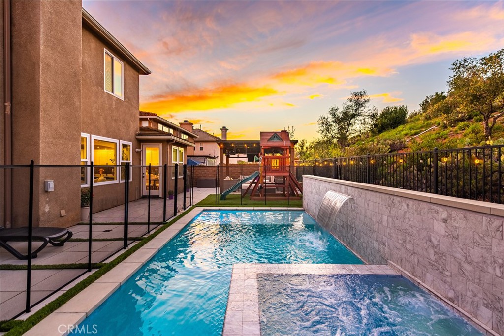 14431 Shawnee Street Moorpark, CA 93021 - Photo 59 of 72 a view of a swimming pool with a lounge chair