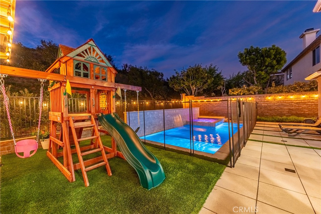 14431 Shawnee Street Moorpark, CA 93021 - Photo 63 of 72 a view of a swimming pool with a bench