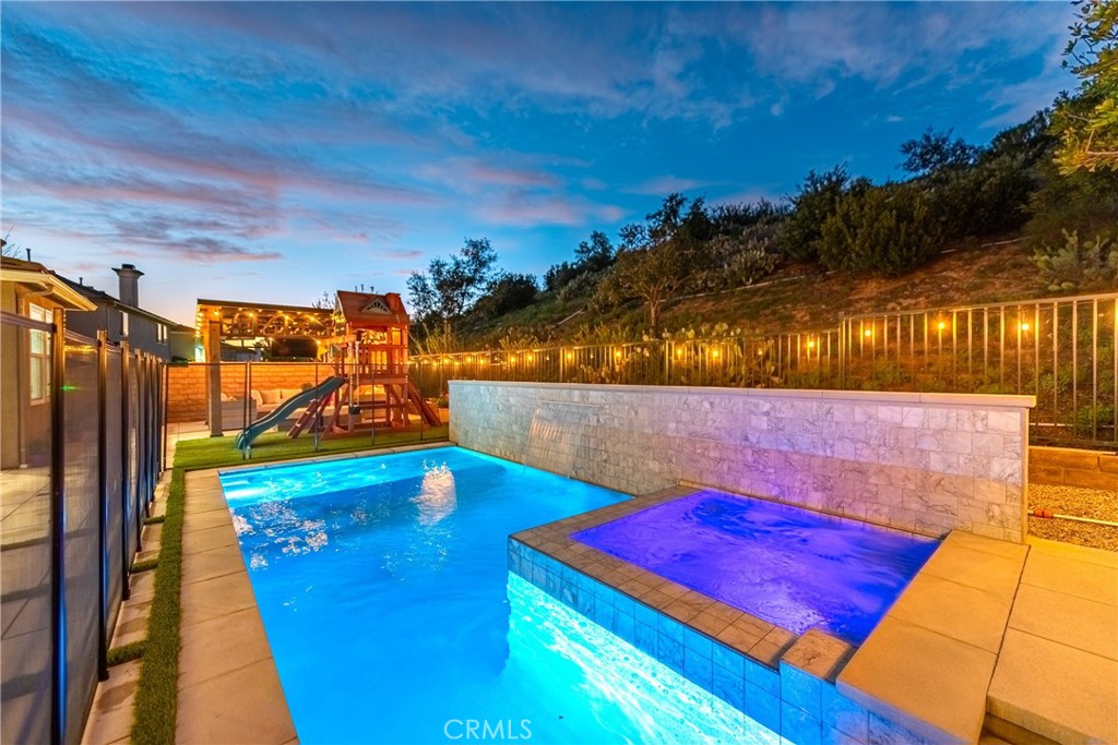 14431 Shawnee Street Moorpark, CA 93021 - Photo 65 of 72 a view of a pool in the backyard of a house