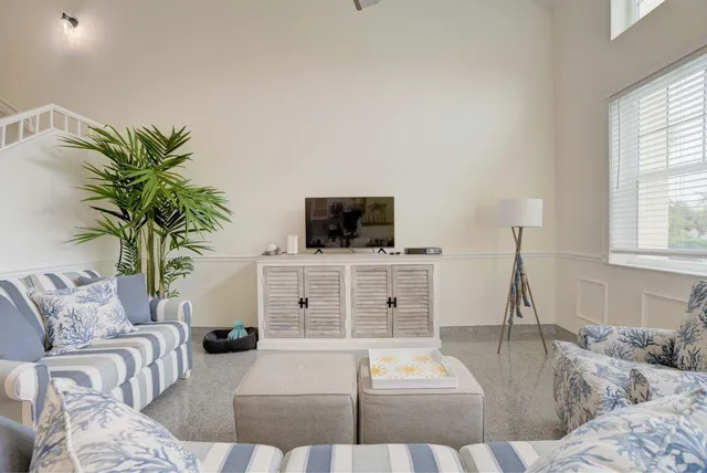 a kitchen with white cabinets and appliances