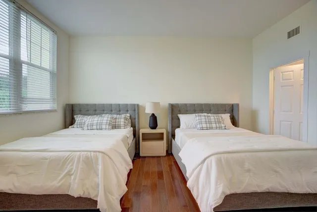 a bathroom with a sink a shower and a mirror