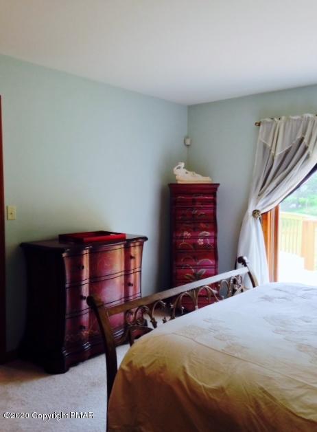 2166 Valleyview Drive Bushkill, PA 18324 - Photo 13 of 18 a bedroom with a bed and a window