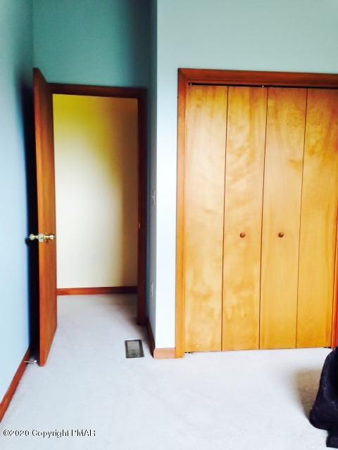 2166 Valleyview Drive Bushkill, PA 18324 - Photo 15 of 18 a bedroom with a bed and a window