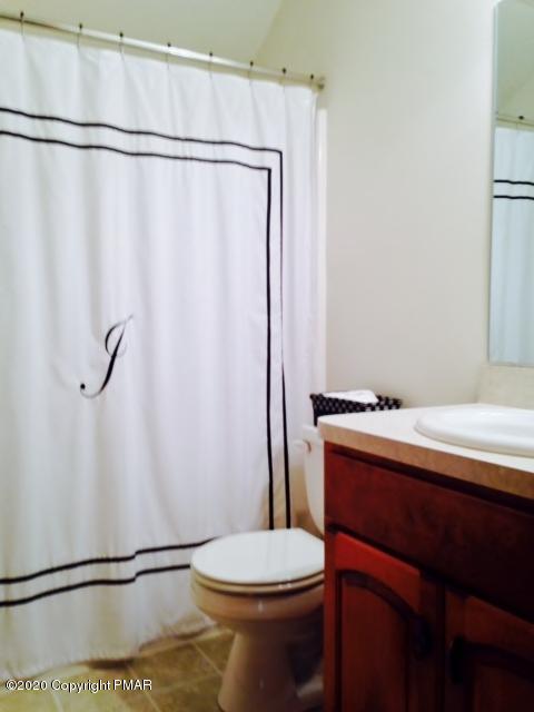 2166 Valleyview Drive Bushkill, PA 18324 - Photo 17 of 18 a bathroom with a sink and toilet