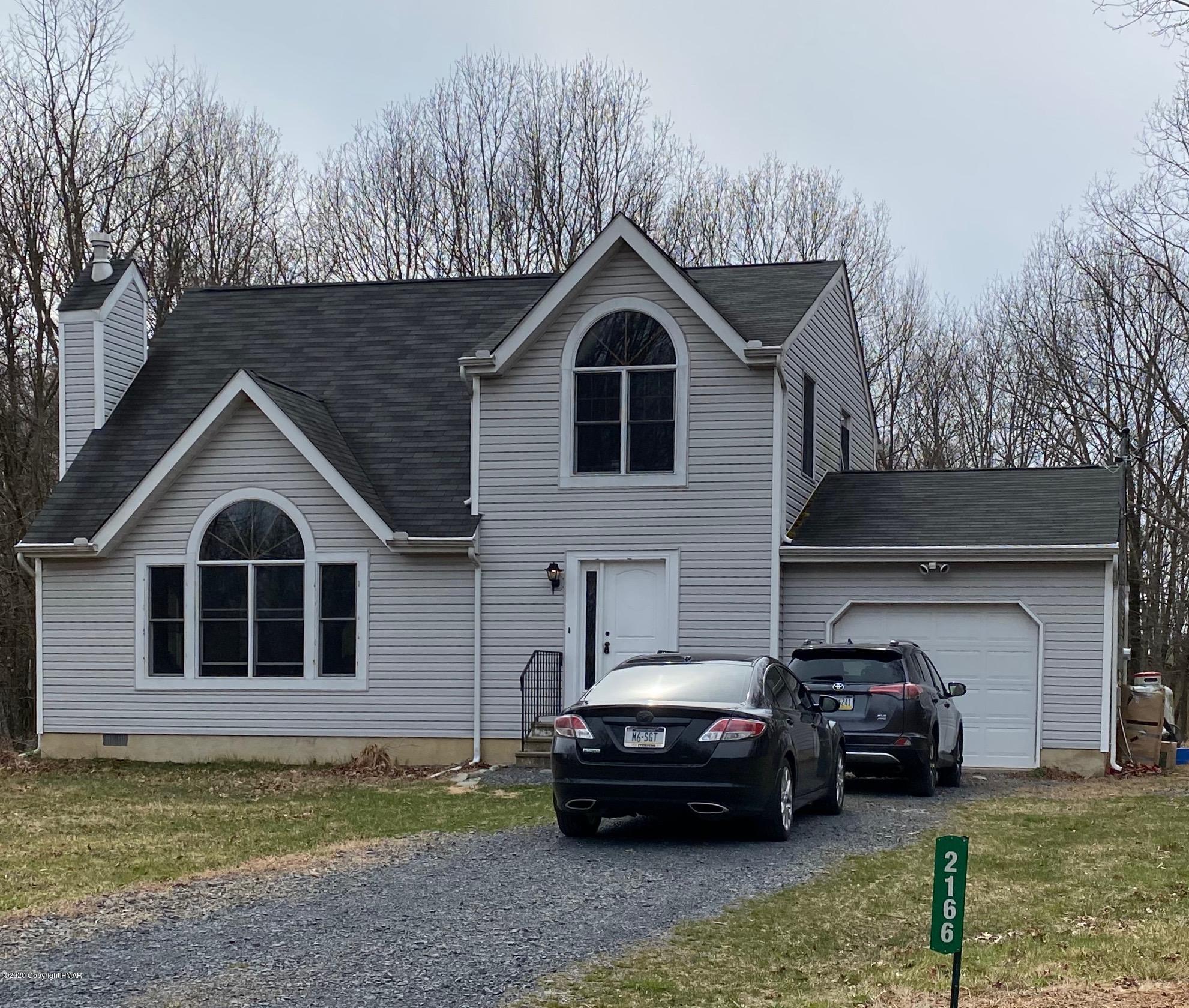 2166 Valleyview Drive Bushkill, PA 18324 - Photo 18 of 18 a front view of a house with a garden