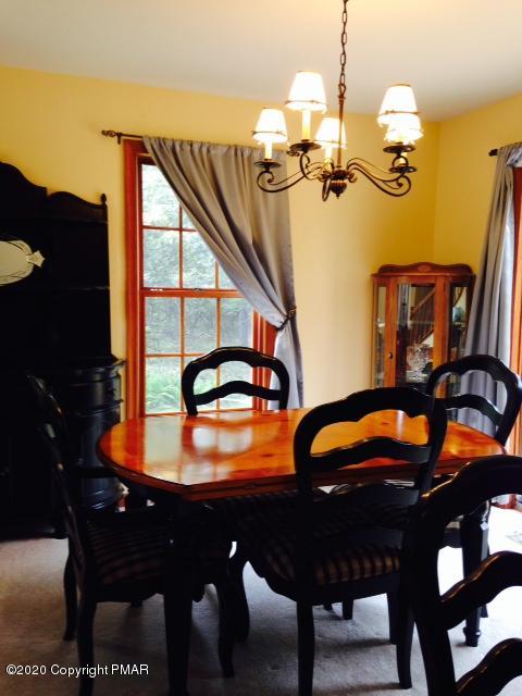 2166 Valleyview Drive Bushkill, PA 18324 - Photo 4 of 18 a dining room with furniture and chandelier