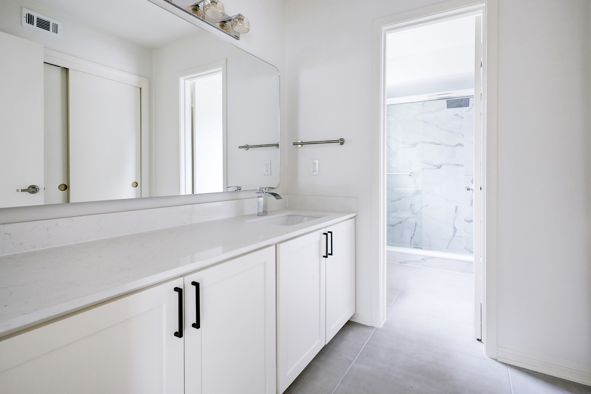 1810 Nocturne Lane Houston, TX 77043 - Photo 18 of 32 a bathroom with a sink and a mirror