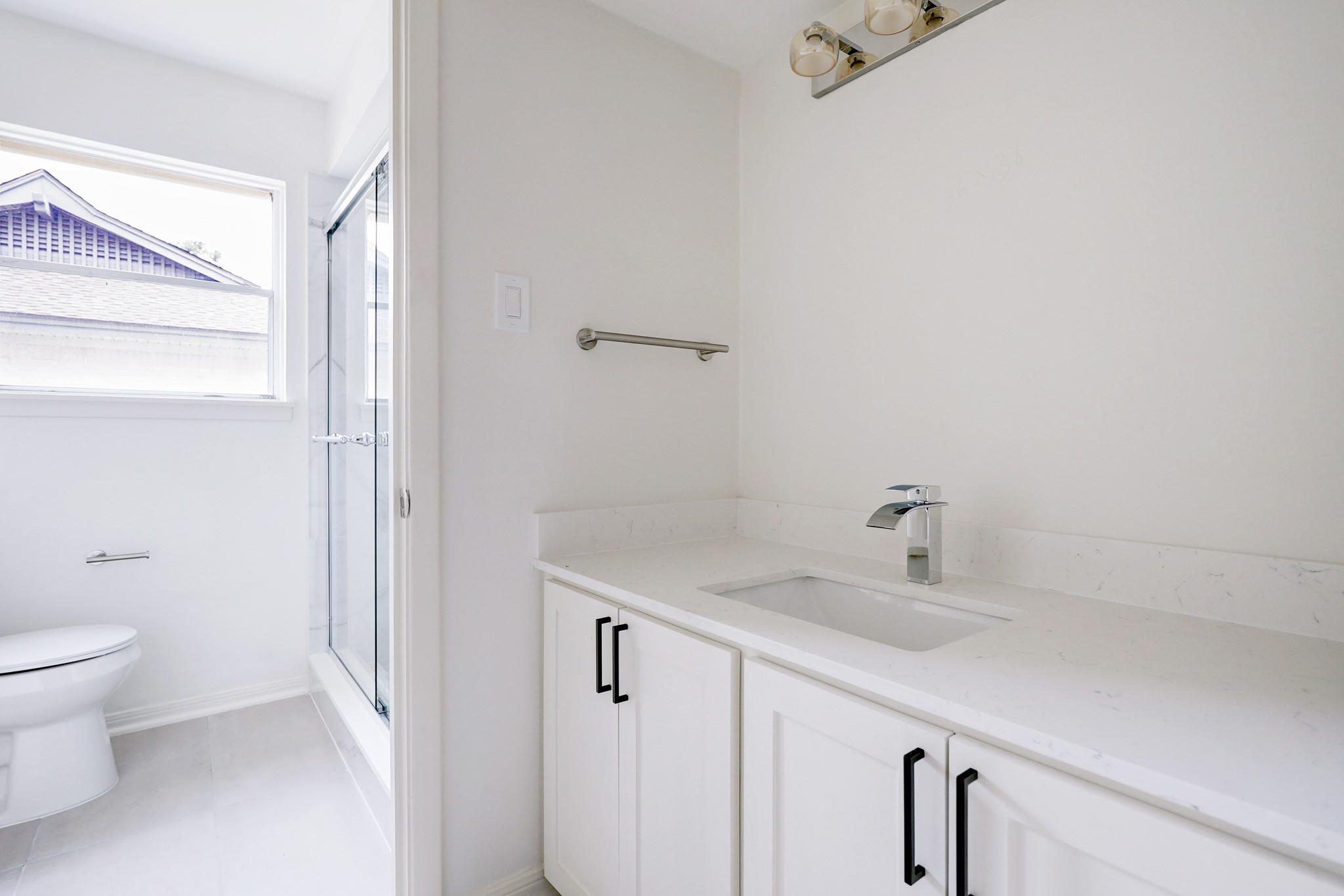 1810 Nocturne Lane Houston, TX 77043 - Photo 20 of 32 a bathroom with a sink and a toilet