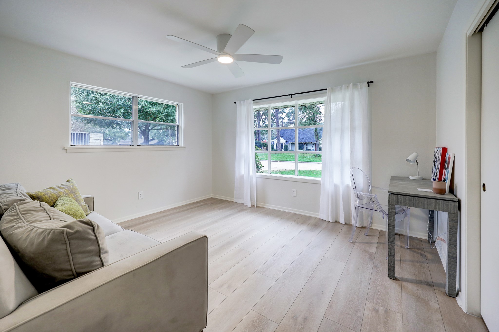 1810 Nocturne Lane Houston, TX 77043 - Photo 21 of 32 a living room with furniture and a window
