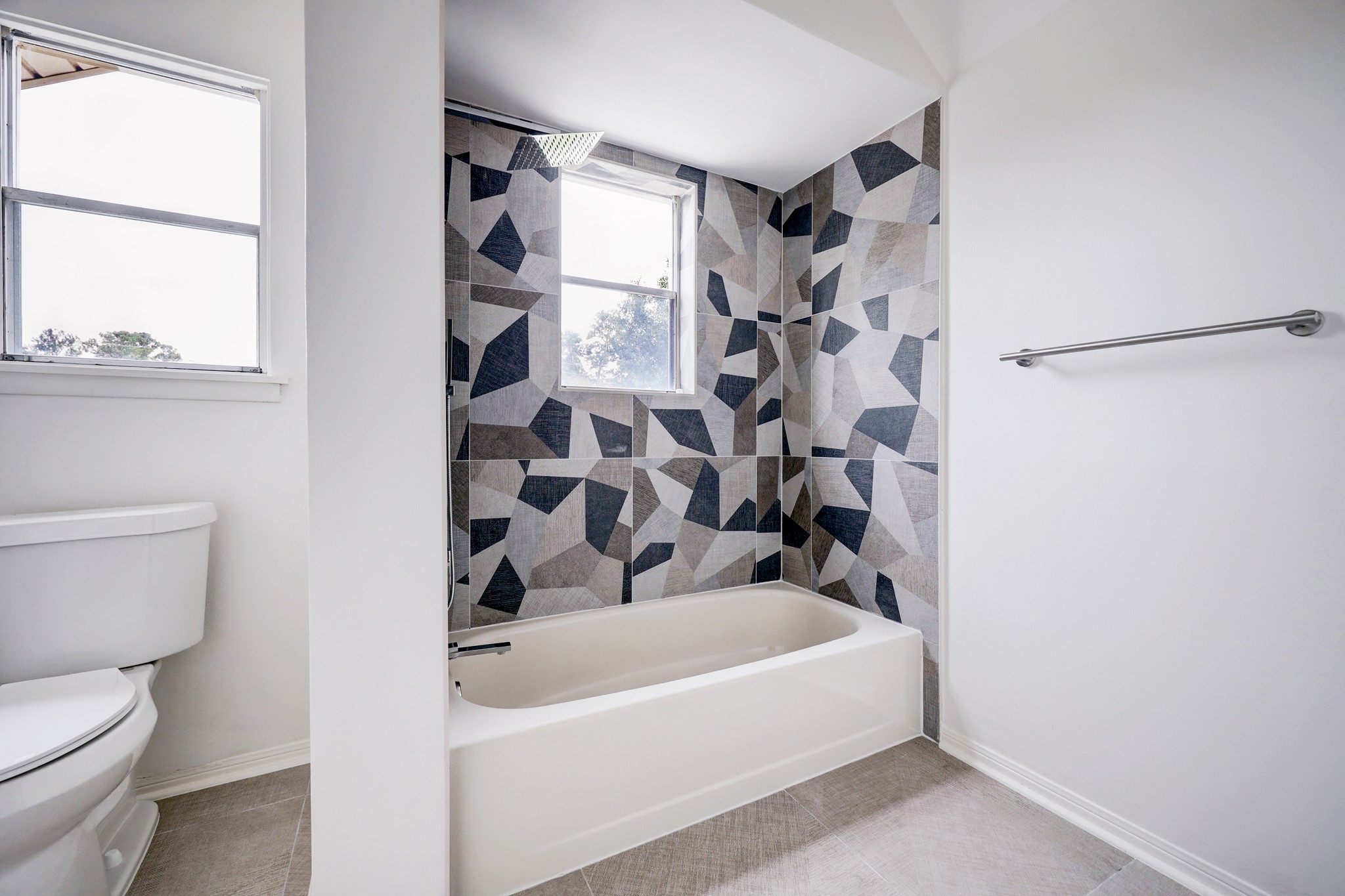 1810 Nocturne Lane Houston, TX 77043 - Photo 26 of 32 a bathroom with a bathtub and a shower